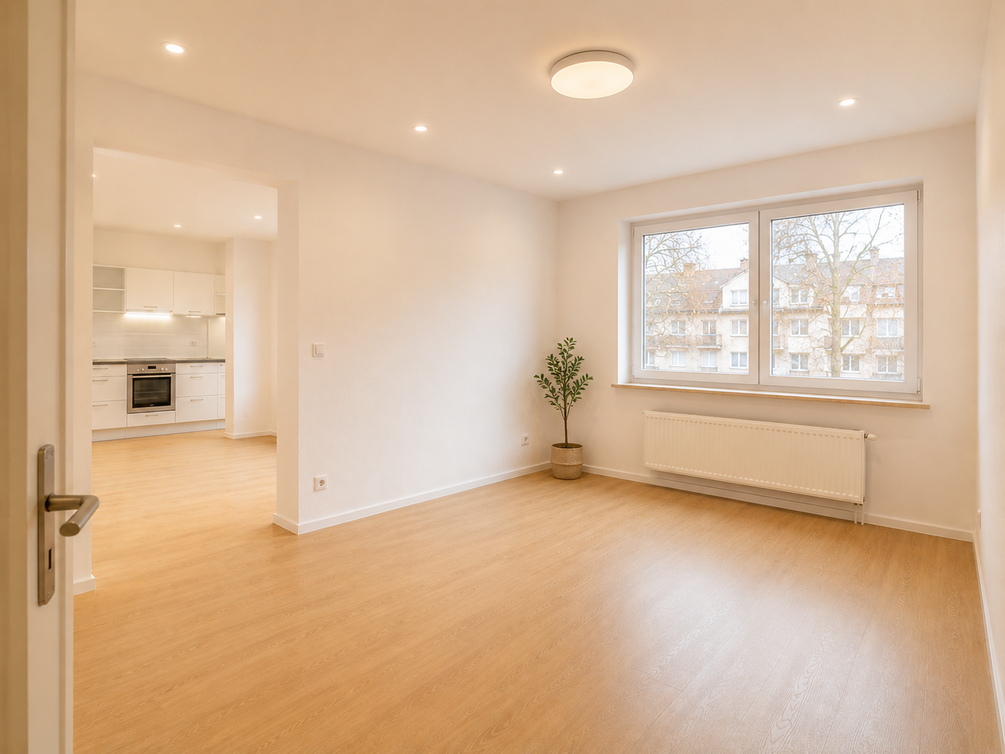Wohnung in Mannheim nach der Komplettrenovierung — frisch renovierte Wohnung mit neuem Parkettboden und offener Küche durch David Fix Haus